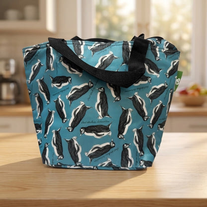 Foldaway penguin lunch bag made from a recycled bottle